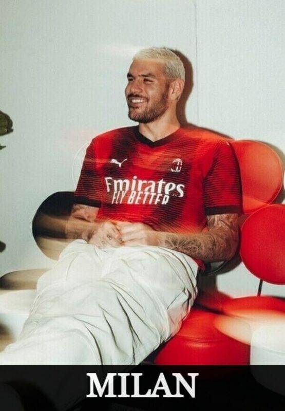 AC Milan player in red and black home jersey celebrating a goal