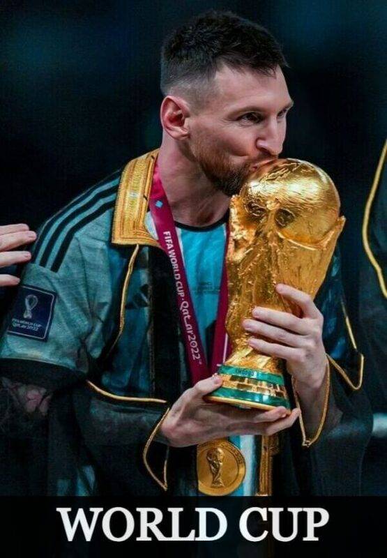 Lionel Messi kissing the World Cup trophy in Argentina jersey 2022
